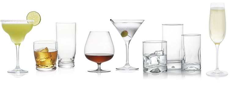 different shapes and sizes of drinking glasses, some empty some full